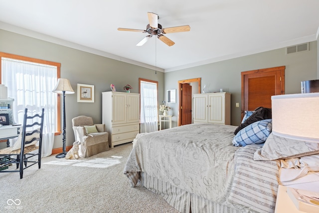 bedroom with light carpet, stainless steel refrigerator, and ceiling fan