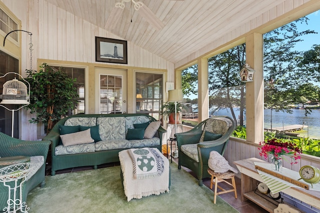 sunroom with vaulted ceiling, a water view, ceiling fan, and wood ceiling