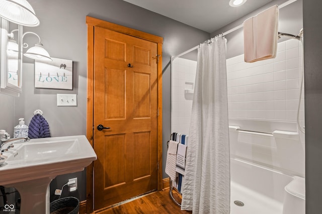 bathroom featuring a shower with curtain and hardwood / wood-style flooring