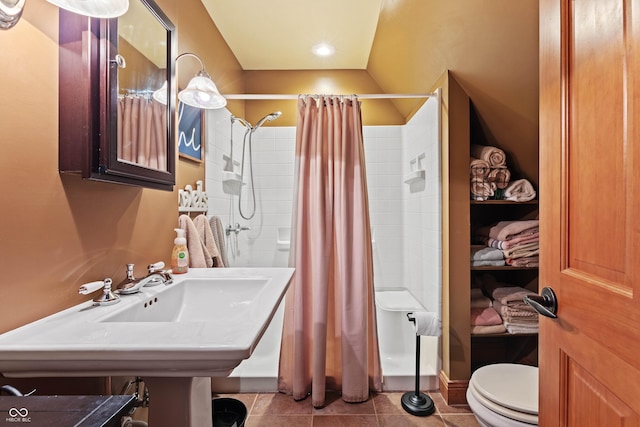 bathroom featuring sink, a shower with curtain, tile patterned floors, and toilet