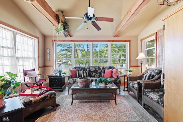 sunroom featuring vaulted ceiling with beams and ceiling fan