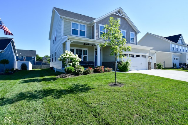 craftsman-style home featuring a garage and a front yard