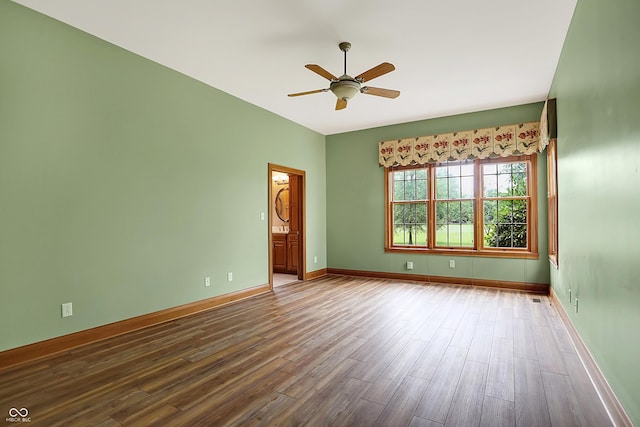 empty room with ceiling fan and hardwood / wood-style flooring