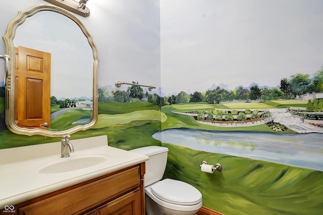 bathroom featuring vanity and toilet