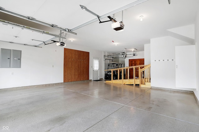 garage with electric panel and a garage door opener