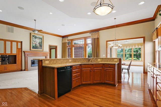 kitchen with ceiling fan with notable chandelier, sink, hardwood / wood-style flooring, and black appliances