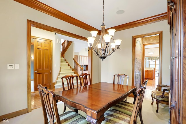 dining area featuring light colored carpet, an inviting chandelier, and crown molding