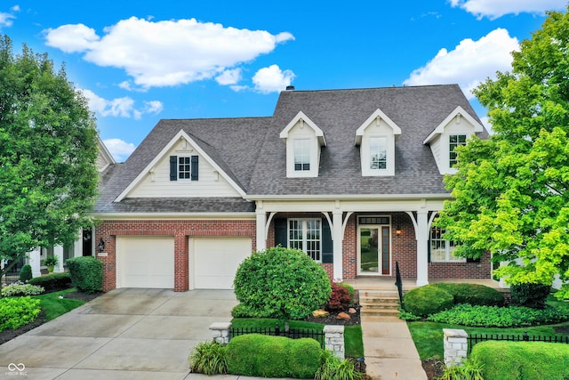 view of front of property featuring a garage and covered porch