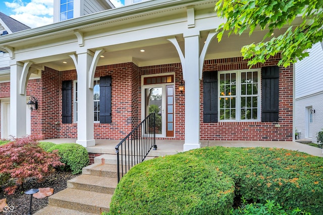 view of exterior entry featuring a porch