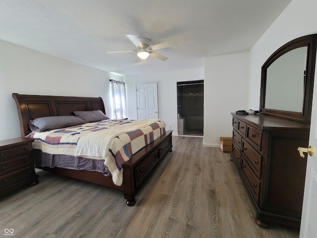 bedroom featuring dark hardwood / wood-style floors and ceiling fan