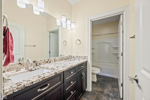 full bathroom with double vanity, toilet,  shower combination, and tile patterned floors