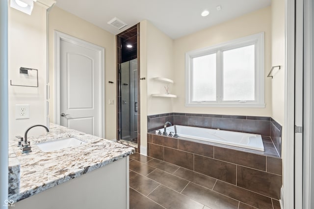 bathroom with vanity, independent shower and bath, and tile patterned floors