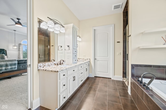 bathroom with dual vanity, tile patterned floors, separate shower and tub, ceiling fan, and ornamental molding