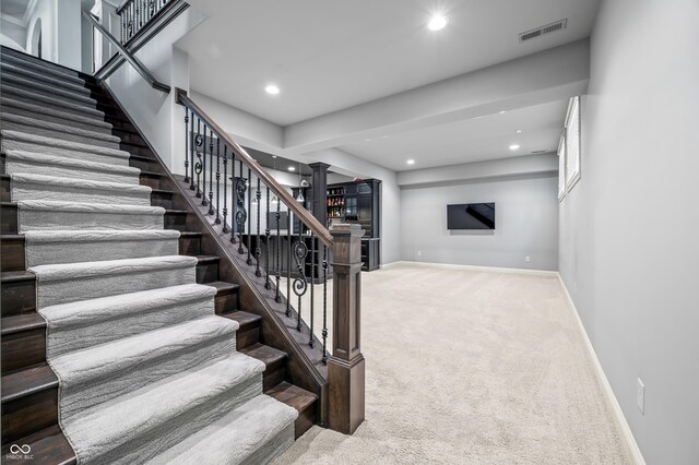 staircase with carpet flooring