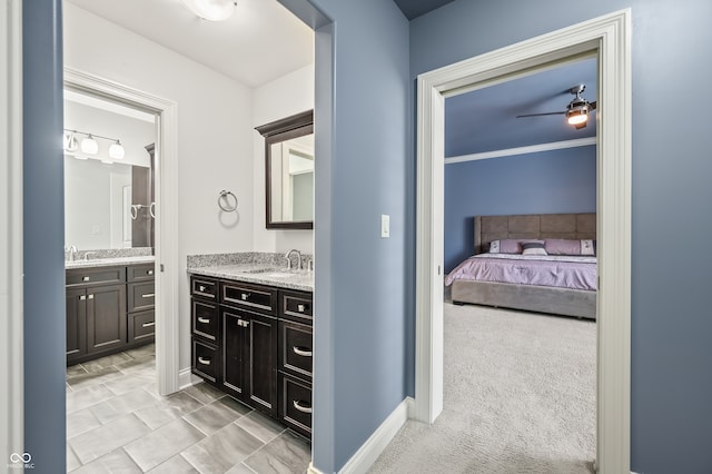 bathroom featuring vanity, tile patterned flooring, crown molding, and ceiling fan