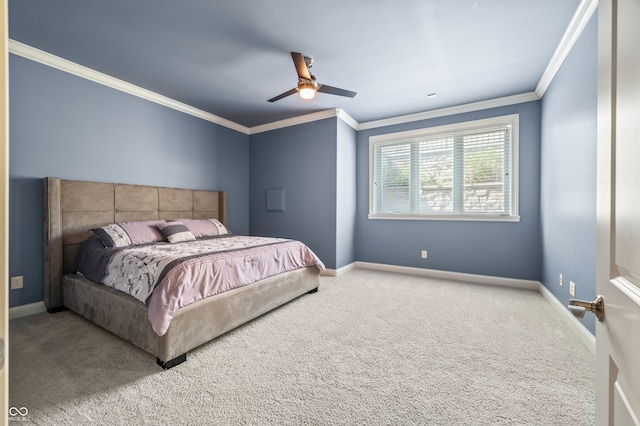 carpeted bedroom featuring ornamental molding and ceiling fan