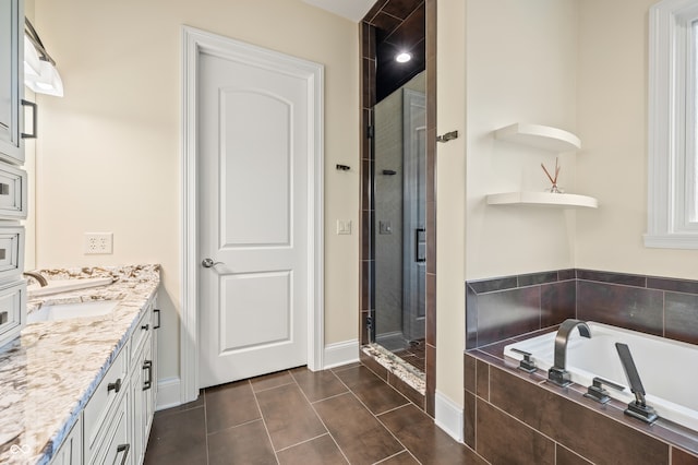 bathroom with vanity, plus walk in shower, and tile patterned flooring