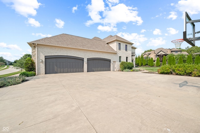 view of side of property with a garage