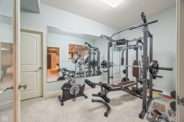 exercise room with carpet flooring