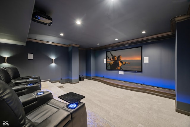 home theater room with crown molding and carpet flooring