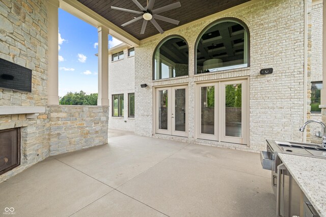 view of patio / terrace featuring french doors and ceiling fan