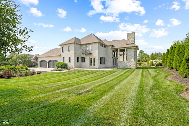 rear view of house with a yard