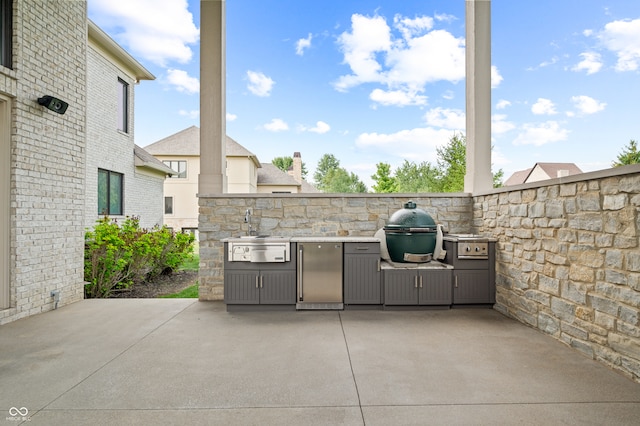 view of patio / terrace featuring grilling area and exterior kitchen