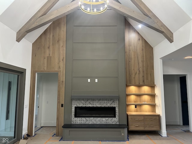 living room featuring beamed ceiling, a notable chandelier, and high vaulted ceiling