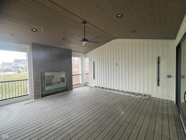 wooden terrace featuring ceiling fan