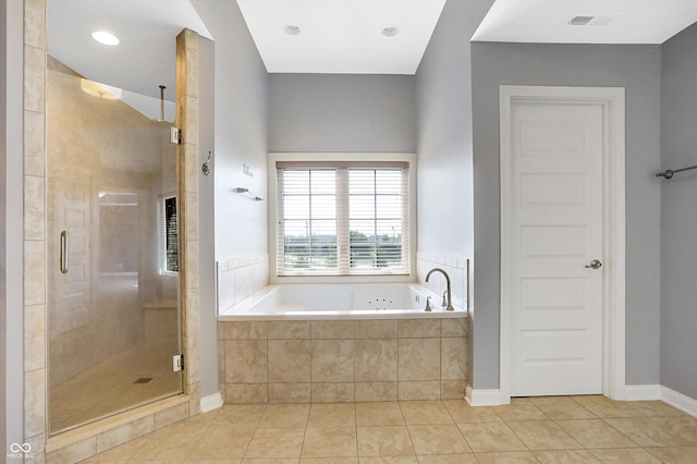 bathroom featuring tile patterned flooring and shower with separate bathtub