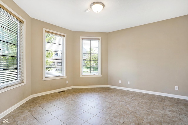 view of tiled spare room