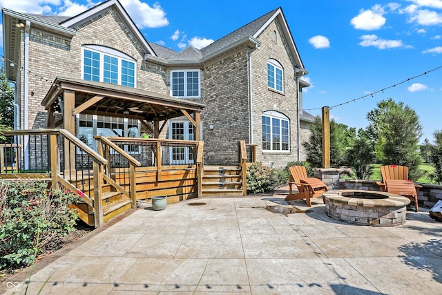 exterior space featuring a fire pit and a patio