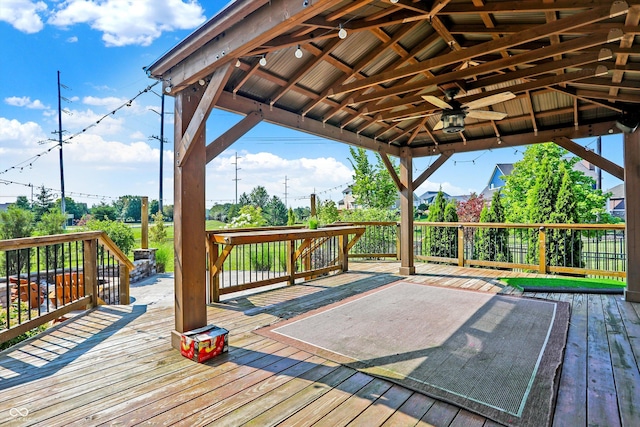 deck with a gazebo and ceiling fan