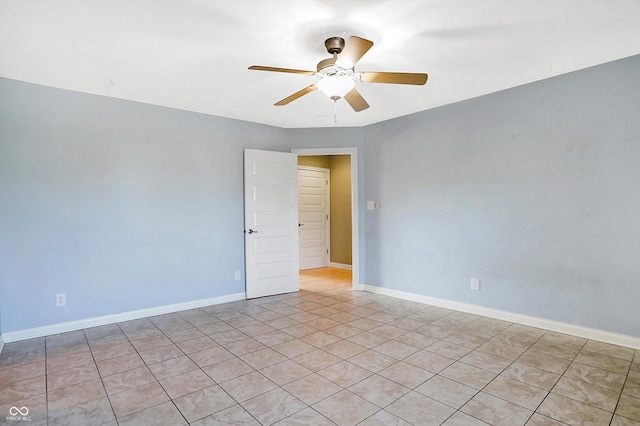 unfurnished room with ceiling fan and light tile patterned floors