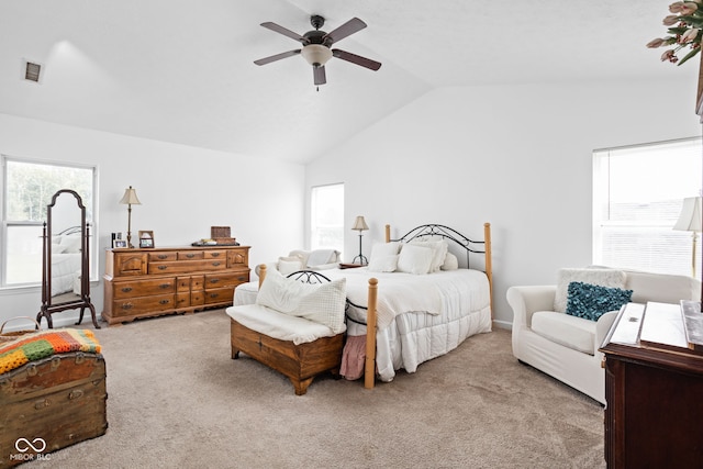 carpeted bedroom with visible vents, a ceiling fan, and lofted ceiling