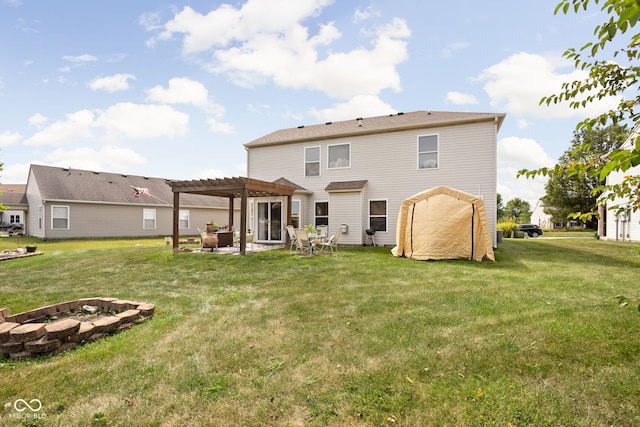 rear view of house featuring a patio area, a yard, a fire pit, and a pergola