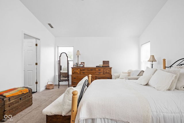 bedroom featuring vaulted ceiling, carpet, visible vents, and baseboards