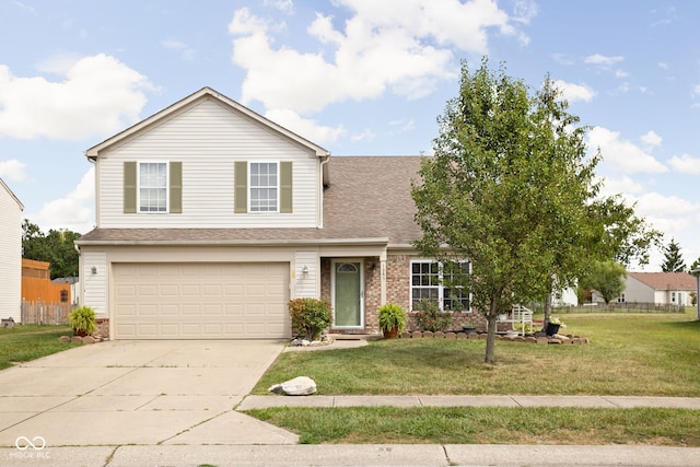 traditional-style home with a garage, brick siding, concrete driveway, and a front yard