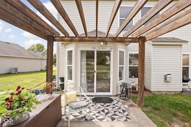 view of patio with central air condition unit and a pergola