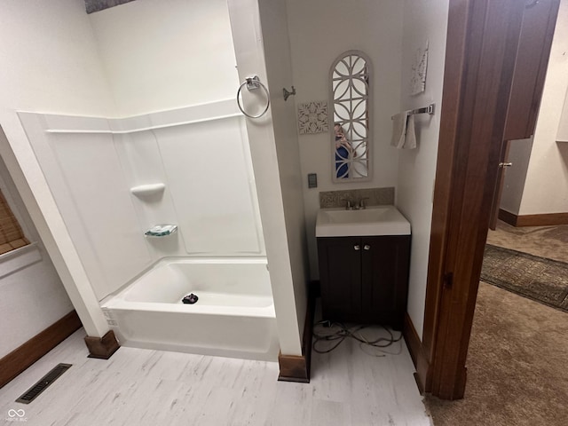 full bathroom with visible vents, baseboards, and vanity