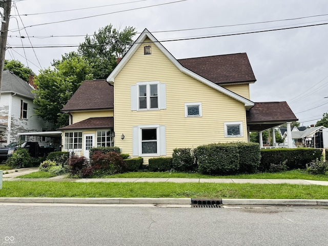 view of front of home featuring roof with shingles
