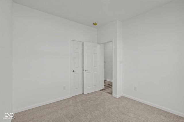 unfurnished bedroom with carpet floors