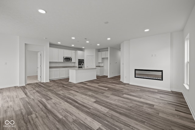 unfurnished living room featuring light hardwood / wood-style floors