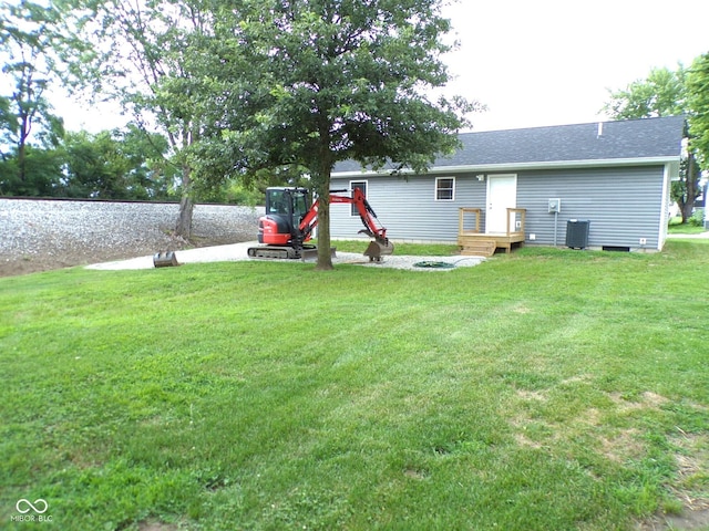 view of yard with central air condition unit