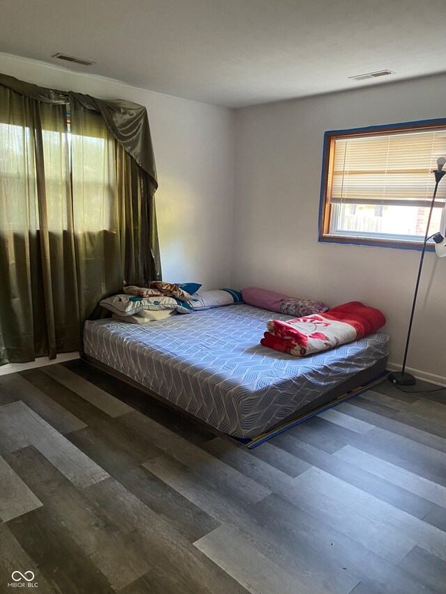 bedroom featuring dark wood-type flooring