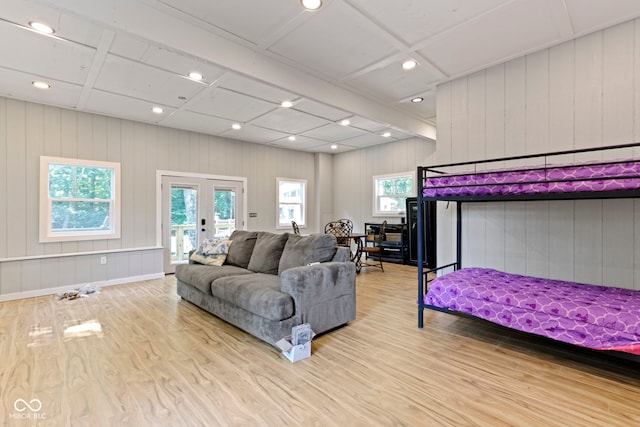 bedroom featuring recessed lighting, wood finished floors, access to outside, french doors, and beamed ceiling