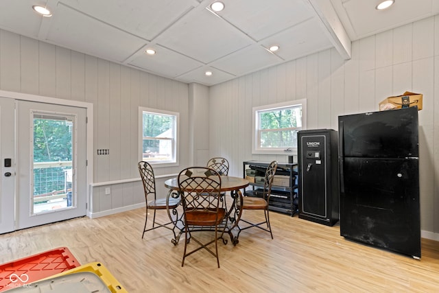 dining space featuring a wealth of natural light, baseboards, and wood finished floors