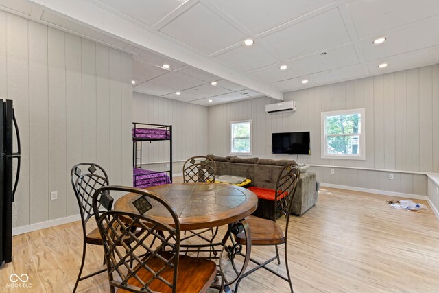 dining space with recessed lighting, an AC wall unit, light wood-style flooring, and baseboards