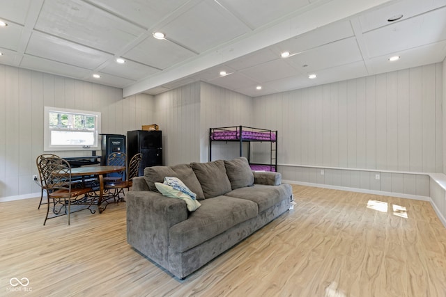 living area with light wood-type flooring, baseboards, and recessed lighting