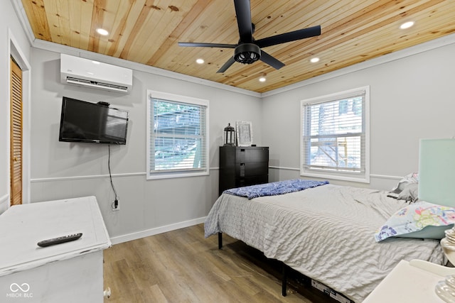 bedroom with wood ceiling, multiple windows, wood finished floors, and a wall mounted air conditioner